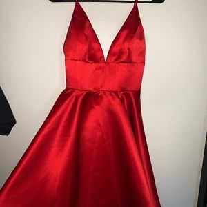 A short sexy red satin dress, with a deep v neck